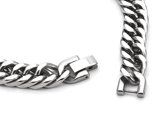 Close-up of a silver chain bracelet on a white background