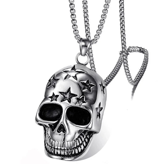 Silver skull pendant necklace with star details on a white background