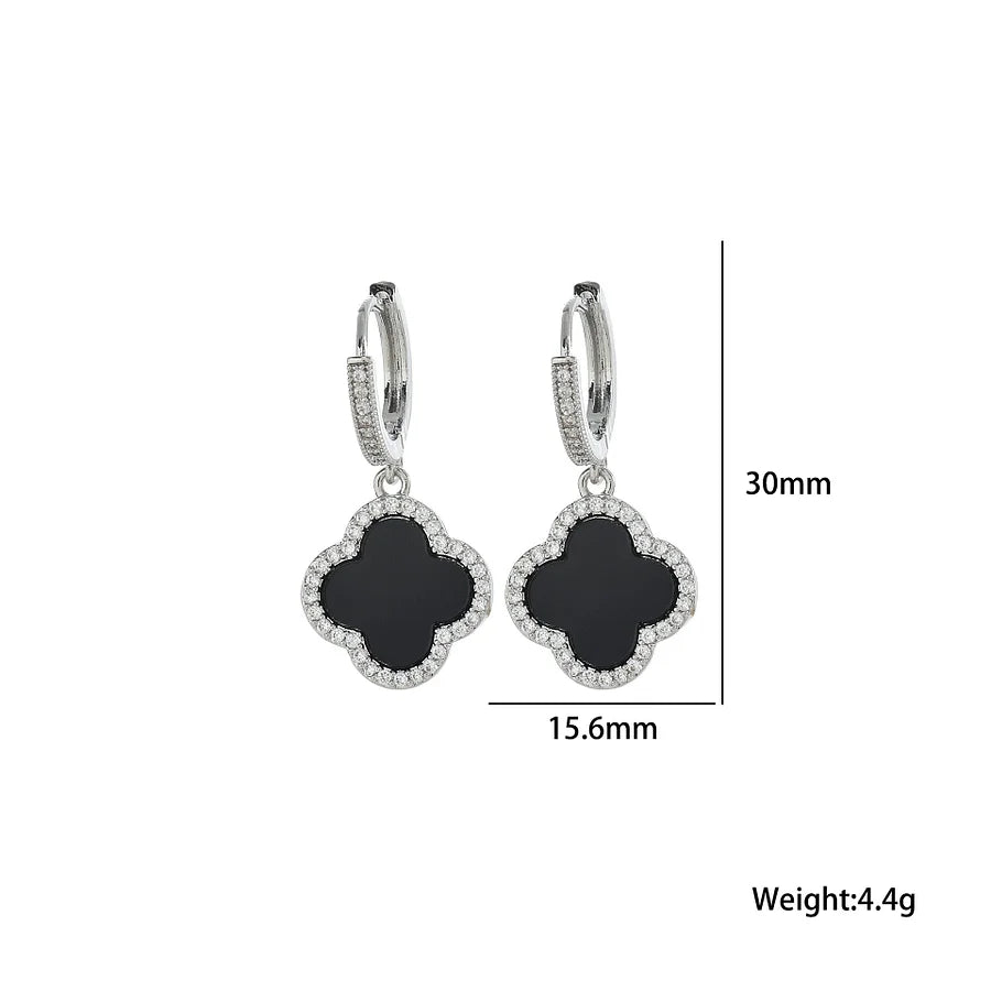 Pair of black clover-shaped earrings with silver accents, shown with measurements on a white background.