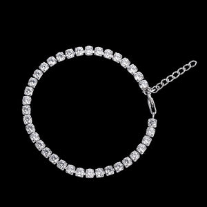 Silver bracelet with clear stones on a black background