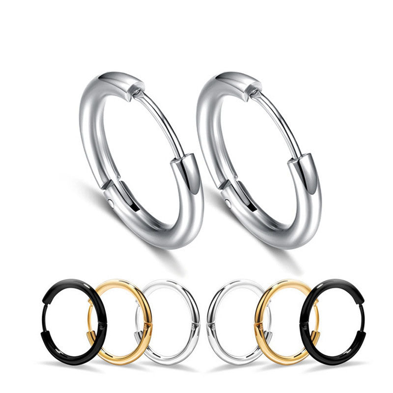 Set of hoop earrings in silver, gold, and black on a white background