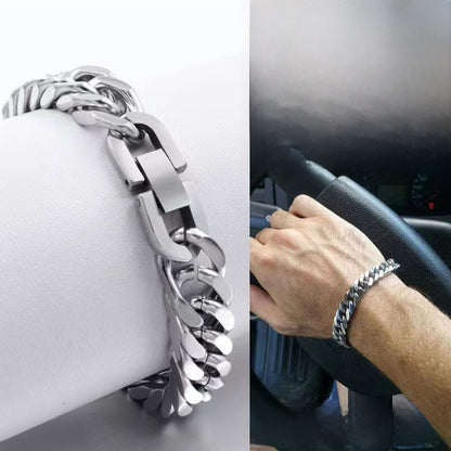 Silver chain bracelet on a car seat and a person's wrist inside a vehicle.