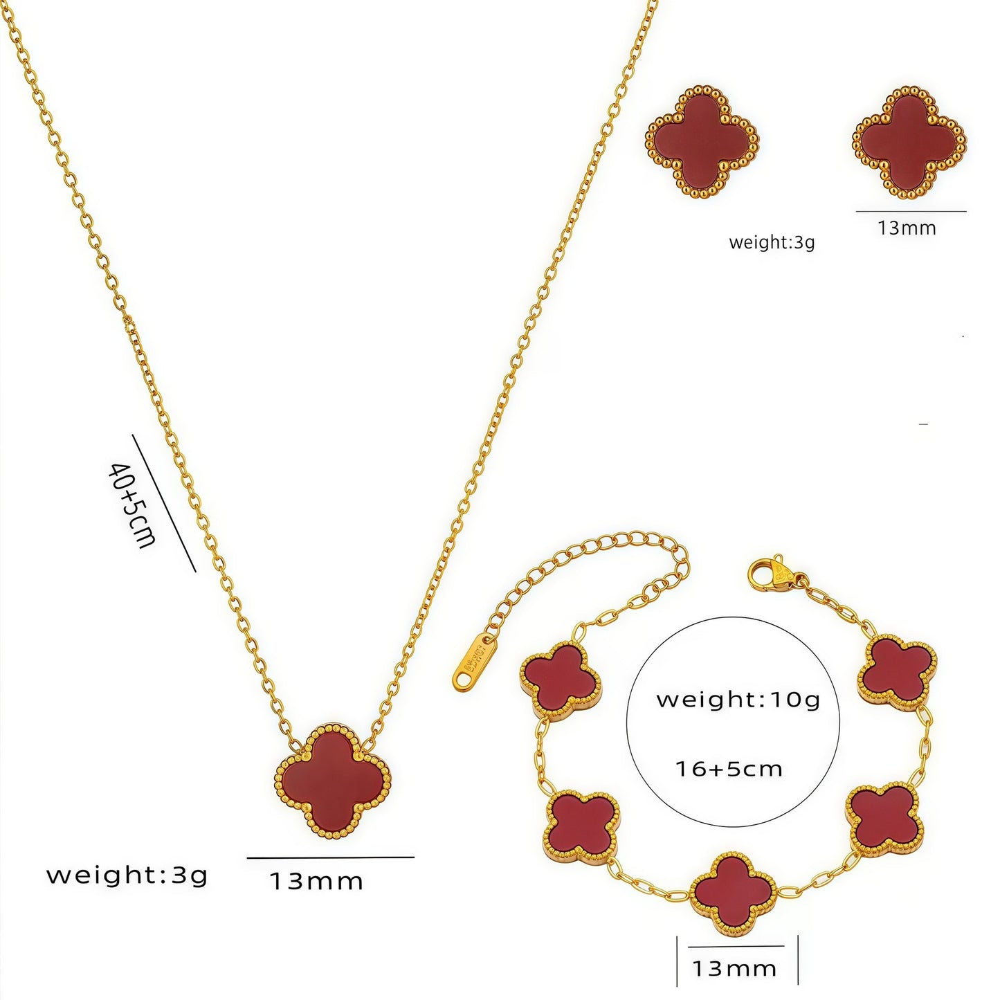 Gold jewelry set with red clover-shaped pendants including necklace, bracelet, and earrings on a white background.