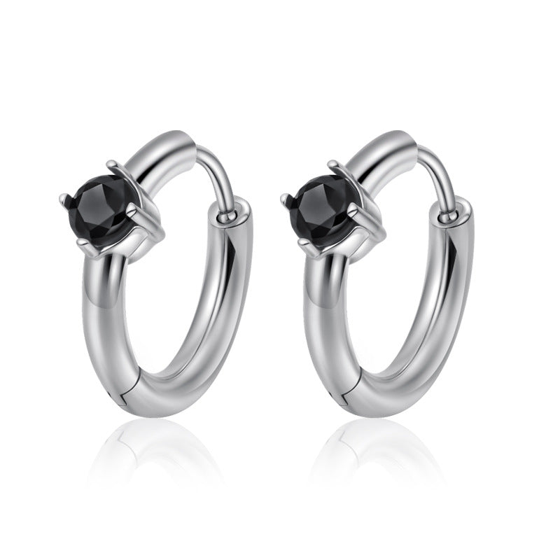 Silver hoop earrings with black gemstones on a white background