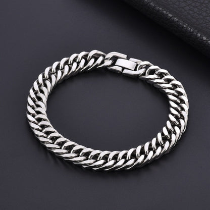Silver chain bracelet on a dark background