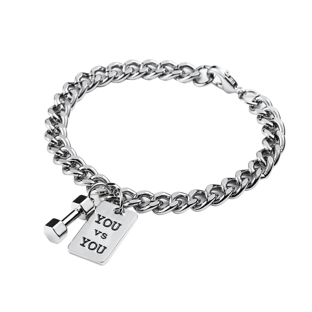 Silver chain bracelet with a tag reading 'YOU VS YOU' on a white background