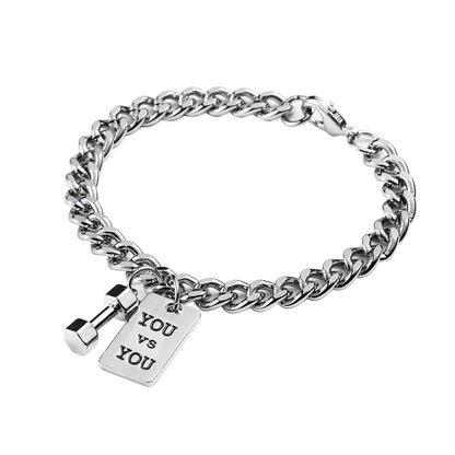 Silver chain bracelet with a tag reading 'YOU VS YOU' on a white background