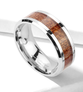 Silver ring with wooden inlay on a white background
